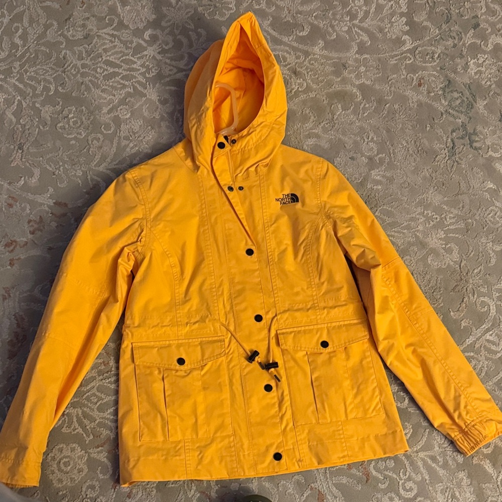 The North Face Bright Yellow Hooded rain jacket open to offers .